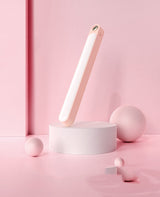 IntelWink Ultra-Thin Magnetic Motion Sensor LED Light Bar in Blush Pink on modern display podium