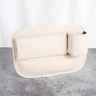 Black PU leather car seat gap filler organizer slotted beside center console holding smartphone and daily items