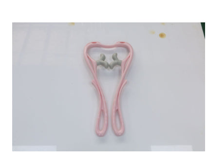 Pink manual neck massager with thumb-shaped silicone pressure nodes