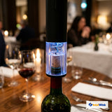 Electric wine bottle opener extracting natural cork with blue LED illumination and transparent
