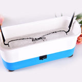 Ultrasonic micro-cavitation waves cleaning eyeglasses frames and lenses in water bath