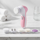IntelWink 5-in-1 Rotary Facial Cleansing Brush with 5 interchangeable treatment heads on white marble